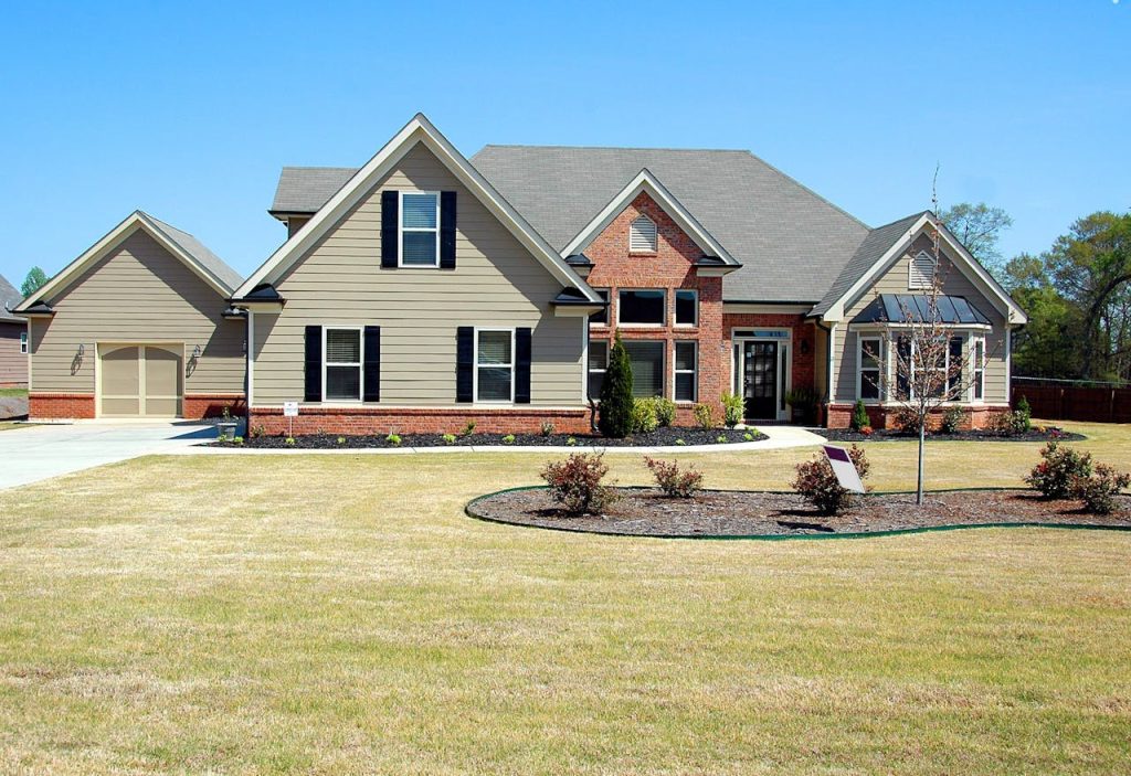 Front view of a modern family home with a landscaped yard.